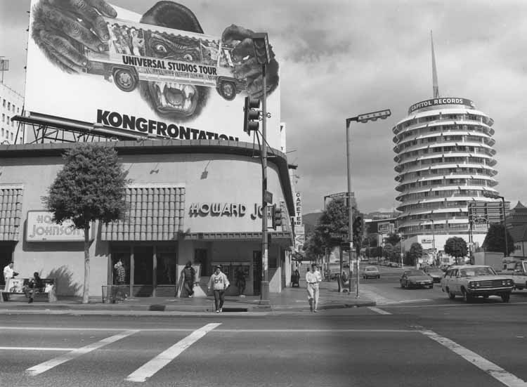 This photo shows the Howard Jones building facing a streetcorner, the Capitol Records Tower is in the background on the right.